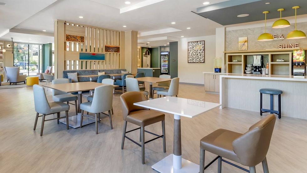 Comfort hotel lobby with modern breakfast area by Choice Hotels