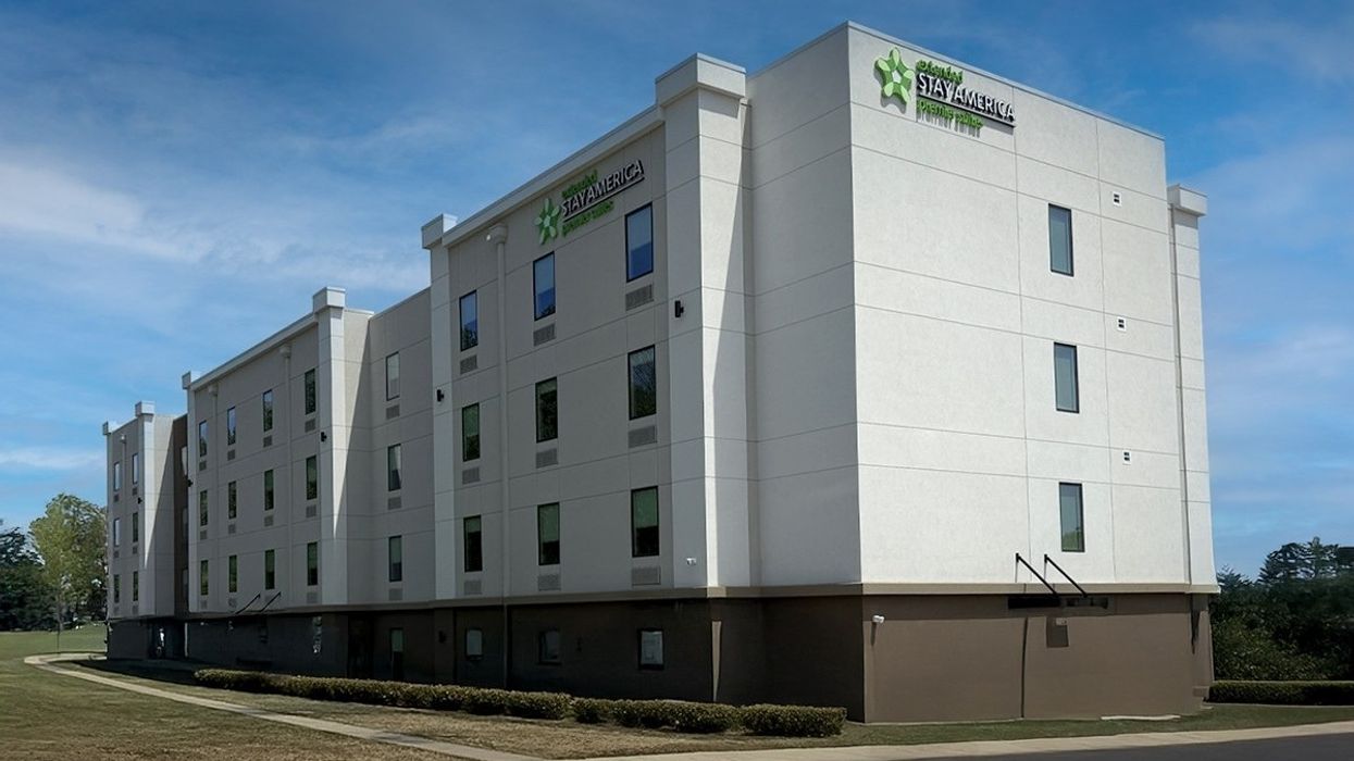 Exterior of Extended Stay America Premier Suites – Charlottesville, a four-story, 92-room hotel in Virginia, designed for extended stays in the USA hospitality sector