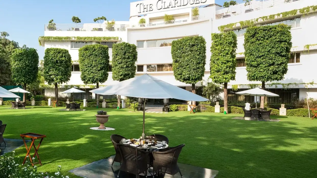 The Claridges New Delhi entrance with IHCL and Claridges Collection branding, reflecting the 2025 partnership for luxury hotel expansion by 2030