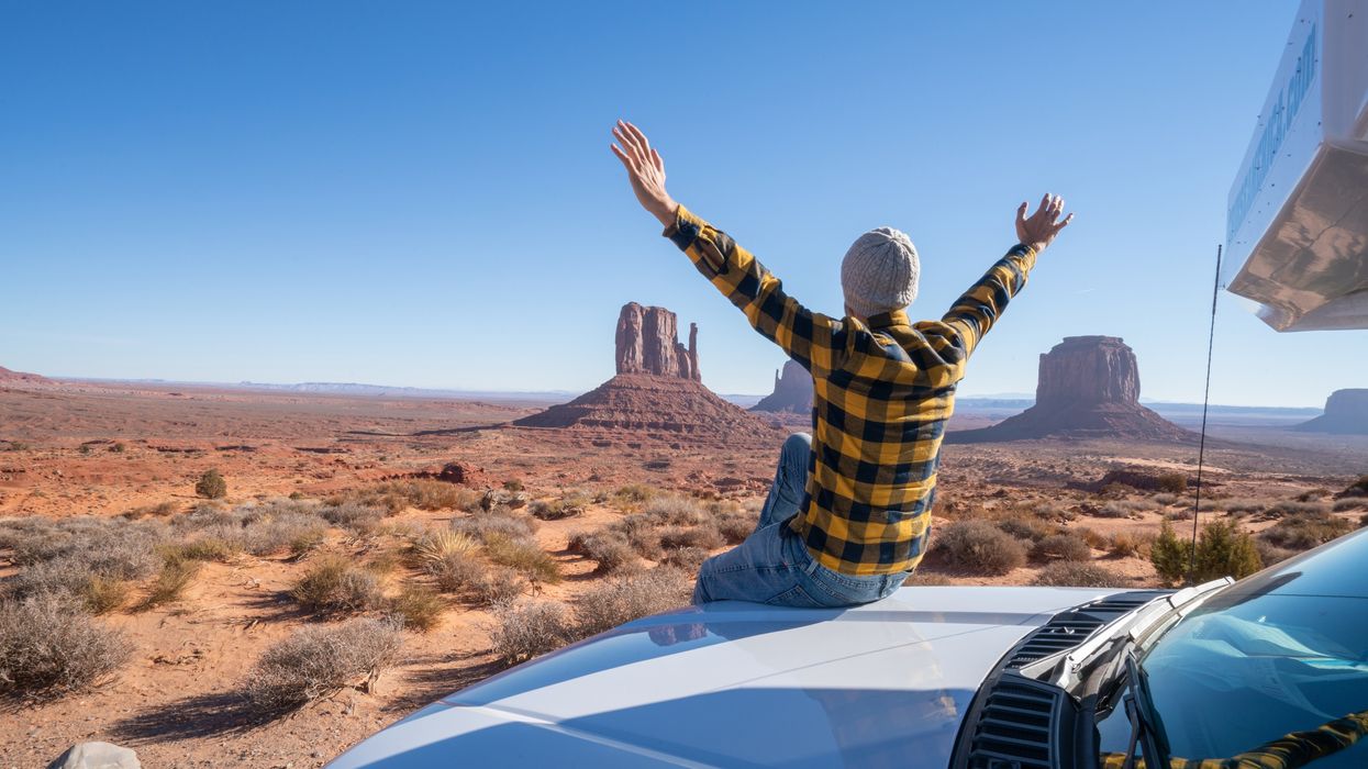 Traveler at Monument Valley reflecting U.S. travel trends 2025