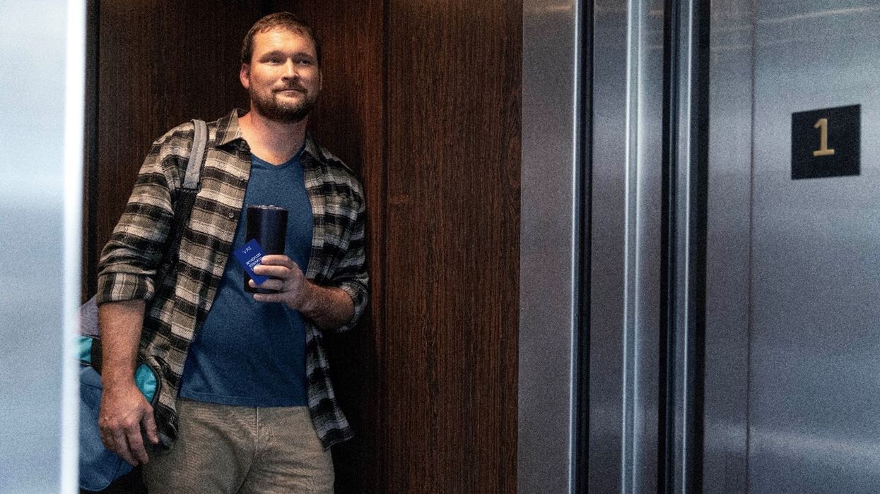 Truck driver resting at Wyndham hotel with Recharge with Wyndham benefits 2025