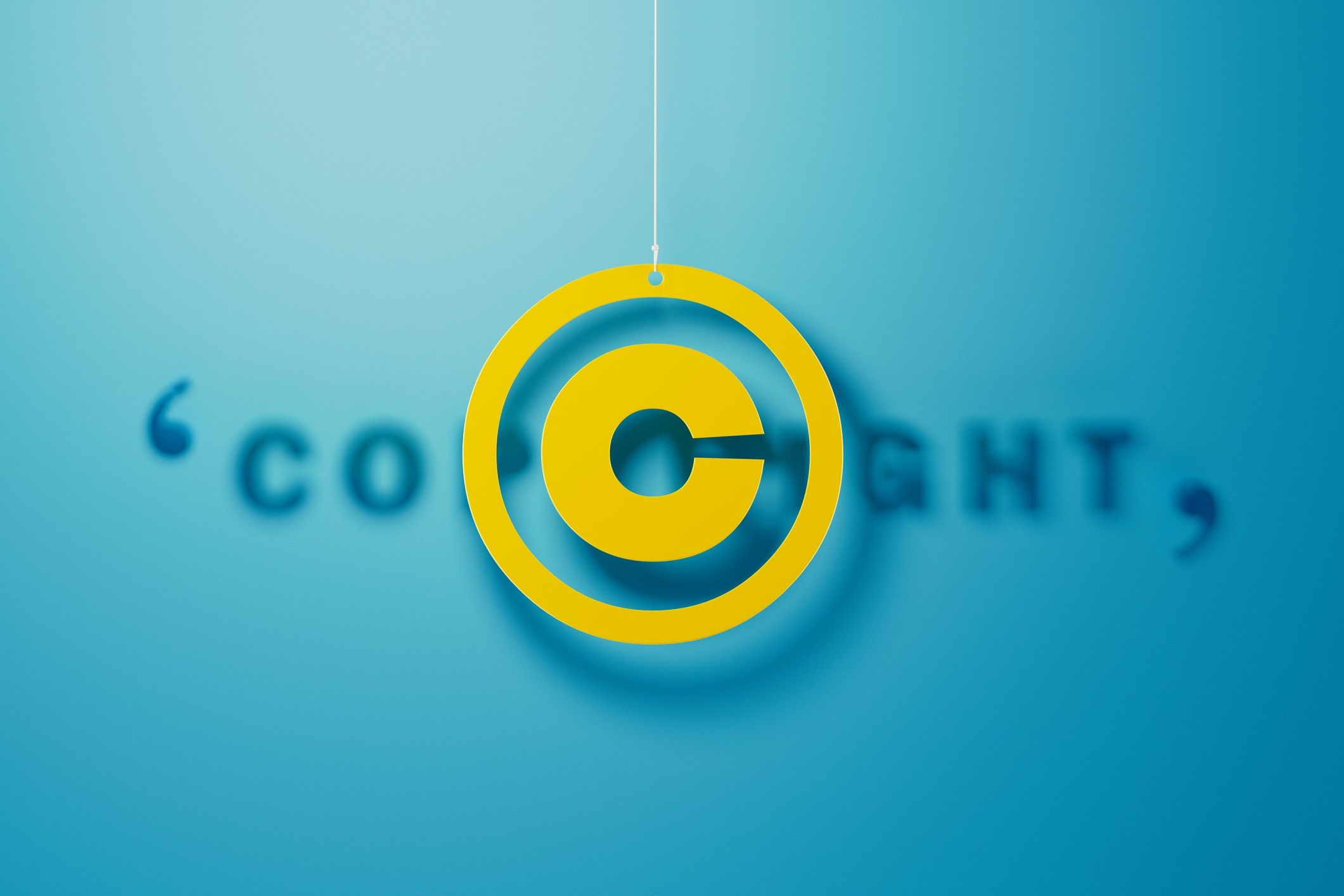 Yellow Copyright Symbol With String Over Blue Background Websrefresh