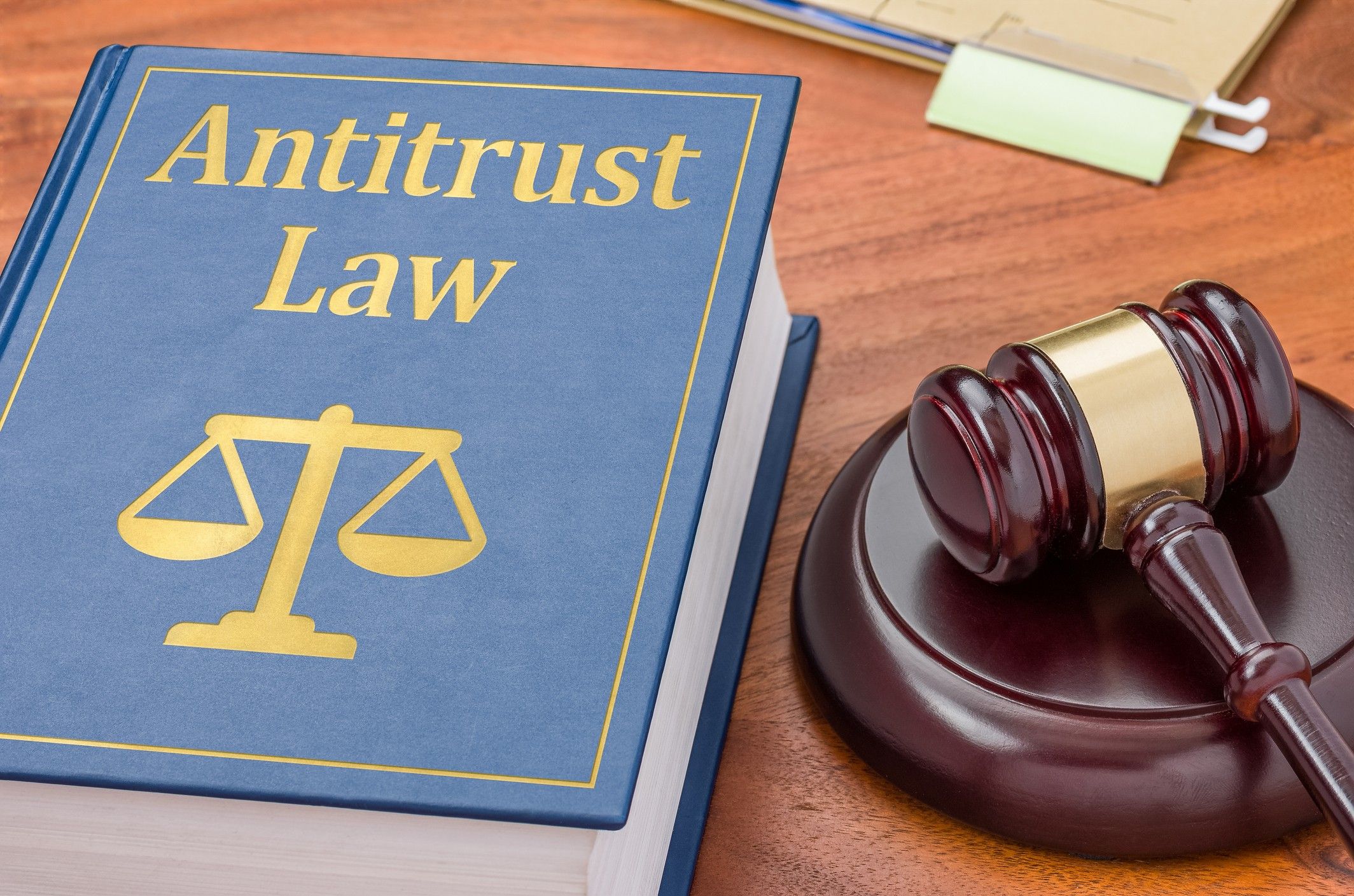 A law book with a gavel - Antitrust law antitrust lawsuit against hotels
